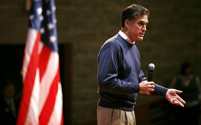 Republican presidential hopeful former Massachussets Gov. Mitt Romney speaks during a meeting with local residents and students, Friday, Nov. 30, 2007, at Kirkwood Community College in Cedar Rapids, Iowa. (AP Photo/Charlie Neibergall)