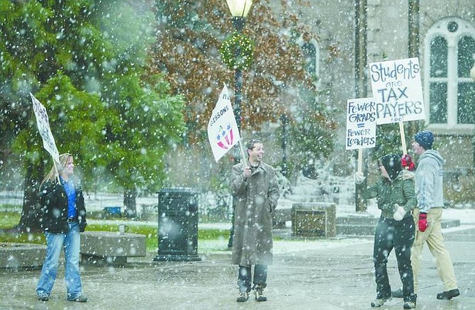 Brad Horn/Nevada Appeal Protesters of an order by Gov. Jim Gibbons to cut 8 percent out of the state&#039;s higher education budget, brave a snowstorm in front of the Capitol on Friday.