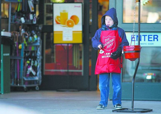 Cathleen Allison/Nevada Appeal Dagen Kipling, 9, rings the bell for the Salvation Army outside SaveMart in North Carson City on Tuesday afternoon. Kipling spent the eight days of Hanukkah giving instead of receiving.