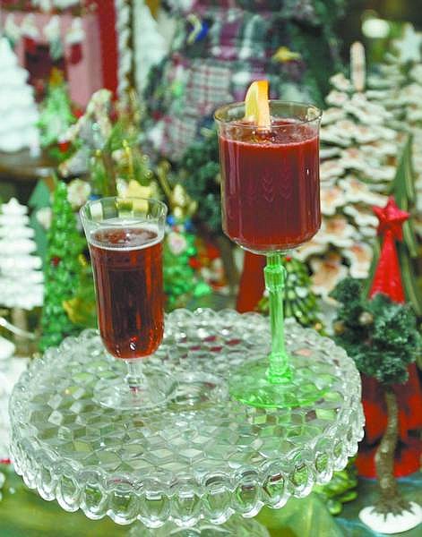 PHOTOSBYBRAD HORN/Nevada Appeal Linda Marrone&#039;s pomegranate-orange cooler. TOP: Marrone&#039;s holiday starters, including tortilla pinwheels and Caesar salad roll-ups.