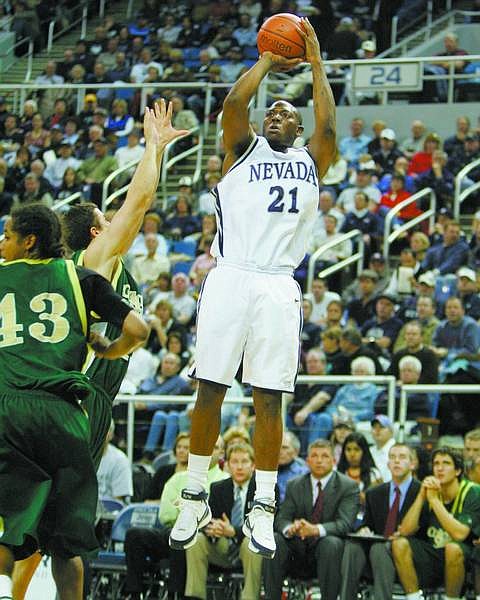 BRAD HORN/Nevada Appeal Nevada&#039;s Marcelus Kemp shoots a three-point basket in front of the Colorado State bench during the first half at Lawlor Events Center on Wednesday.