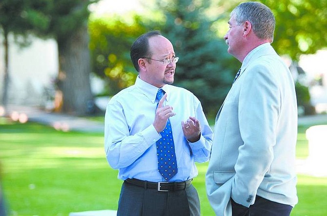 Cathleen Allison/Nevada Appeal Jose Delfin, Carson&#039;s associate superintendent, left, talks with Carson High School principal Ron Beck Tuesday night at an event honoring new teachers at the Governor&#039;s Mansion. Both administrators take new positions this year.