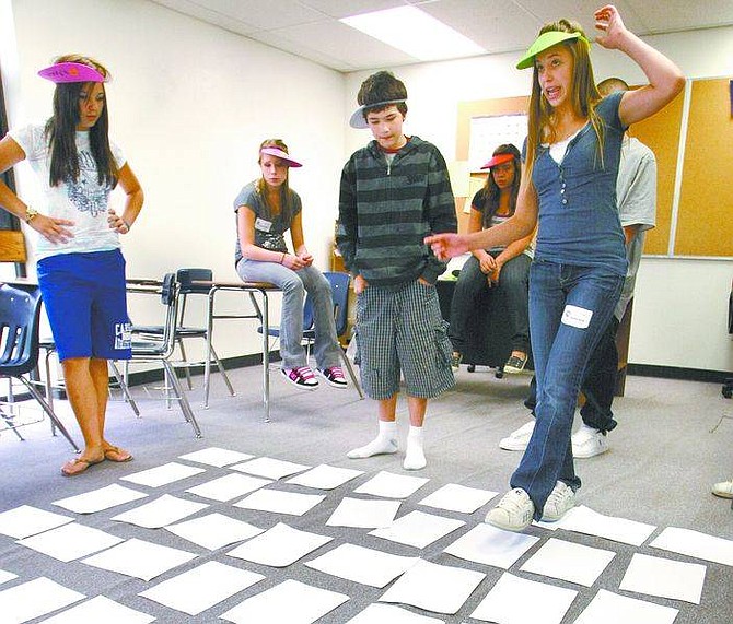 Cathleen Allison/Nevada AppealKarenza Strode, 14, and a group of fellow freshman play team-building games during freshmen orientation Tuesday at Carson High School. More than 700 freshman join the ranks at CHS next week.