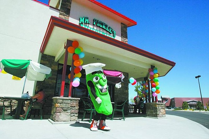 BRAD HORN/Nevada AppealErik Cruise, 17, plays air guitar in front of the new Mr. Pickle&#039;s Sandwich Shop in Carson City on Friday afternoon.
