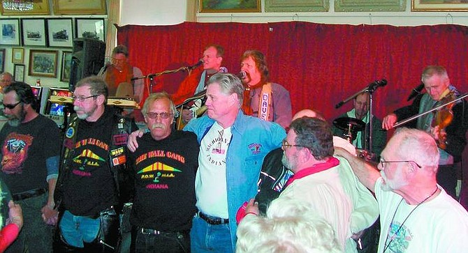 Karen Woodmansee/Nevada Appeal A group of Vietnam veterans were honored at the Bucket of Blood in Virginia City by David John and the Comstock Cowboys and their audience on Sunday.