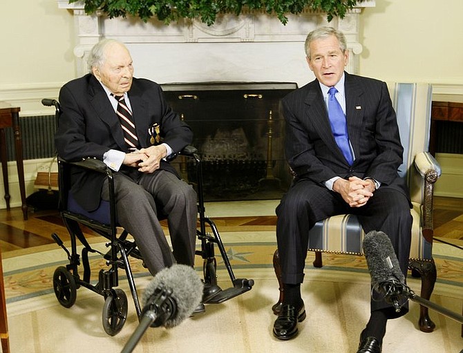 President Bush meets with World War I veteran Army Cpl. Frank Woodruff Buckles, 107, from Charles Town, W.Va.,Thursday, March 6, 2008, in the Oval Office of the White House in Washignton. (AP Photo/Charles Dharapak)