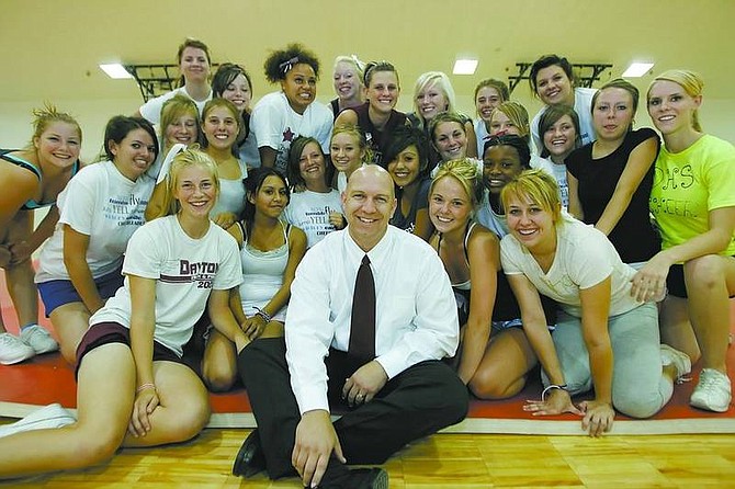 BRAD HORN/Nevada AppealDayton High School&#039;s new principal, Wayne Workman, sits in the gym with the Dayton High School cheerleading squad during their training camp Friday.