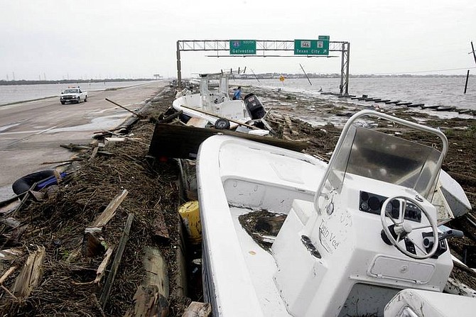 Eric Kayne/Houston Chronicle Boats and debris line the southbound lanes of Interstate-45 in Kemah, Texas, Saturday after Hurricane Ike hit the area.