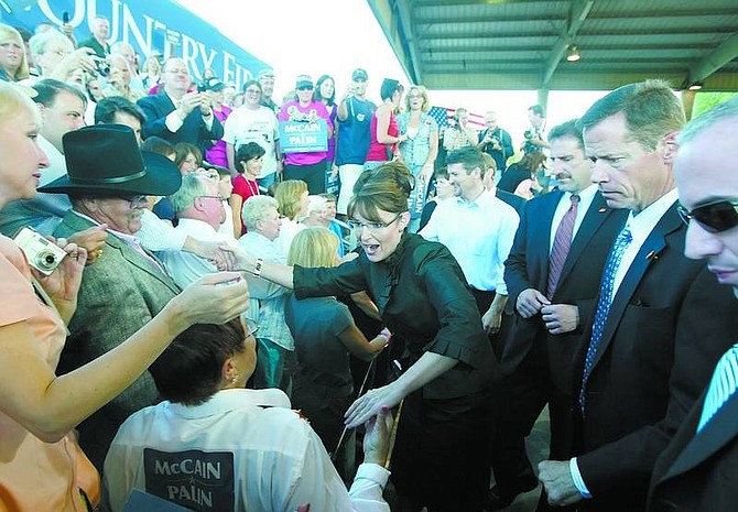 BRAD HORN/Nevada Appeal Republican vice presidential candidate, Alaska Gov. Sarah Palin, shakes hands with audience members after speaking at the Pony Express Pavillion at Mills Park on Saturday.