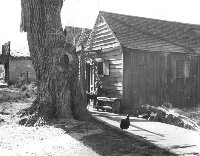 This elderly  Chinese man reading in front of his house was one of the few remaining residents of Carson City&#039;s Chinatown in the mid-1940s.  Daun Cohall  collection/Nevada State Museum
