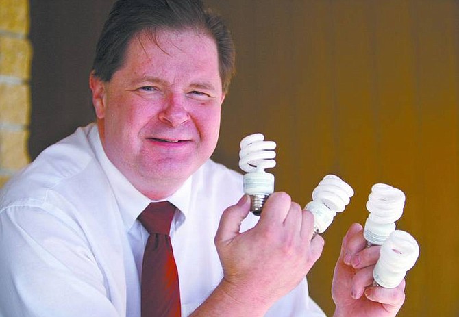 Cathleen Allison/Nevada Appeal Ray Hirschmugl is on a crusade to get every apartment complex in Carson City to switch to fluorescent light bulbs.