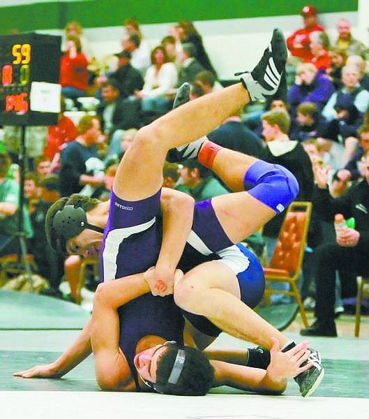 BRAD HORN/Nevada Appeal Carson&#039;s Junior Valladares, 15, wrestles Jacob Gil, 14, at the Northern 4A Wrestling Championships at Hug High School on Friday. Valladares won this match.