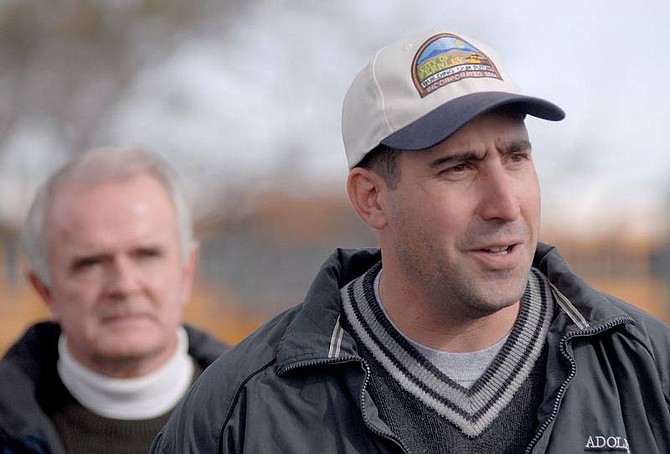 Kevin Clifford/Nevada Appeal Fernley Mayor Todd Cutler, right, updates the media about flood conditions during a news conference on Saturday in Fernley.