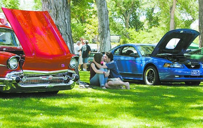 BRAD HORN/Nevada AppealA couple kisses on the lawn at Mills Park during the 14th annual Silver Dollar Car Classic on Saturday.