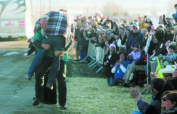 BRAD HORN/Nevada Appeal Steve Boettcher picks up &quot;Extreme Makeover: Home Edition&quot; star Ty Pennington after the minister saw his new home in Stagecoach on Friday afternoon.