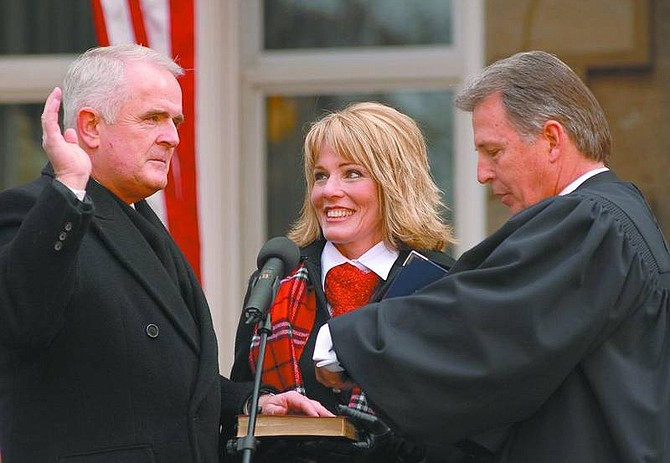 Kevin Clifford/Appeal file photoJim Gibbons takes the Governor&#039;s Oath of Office before Nevada Supreme Court Chief Justice William Maupin in this Nevada Appeal file photo. The governor and first lady were unavailable to comment on rumors they are divorcing.