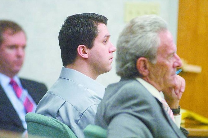 Michael Maresh/Nevada Appeal News ServiceRichard Kyle Frank Molina, left, was found not guilty of two counts of lewdness with a child under 14 and one count of sexual assault on a child under 14. Here he listens to court arguments with his attorney, Jeffrey Freeman.