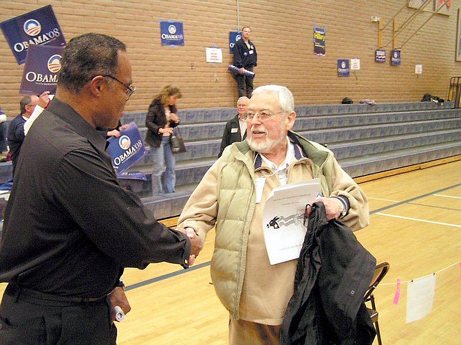 GEOFF DORNAN/NEVADA APPEAL Obama supporter Clif Macklin, left, congratulates Tom Farrer after Farrer switched his support from Hillary Clinton to Barack Obama at Saturday&#039;s Carson City Democratic convention. He was the only pledged delegate from the January caucuses to make the switch.