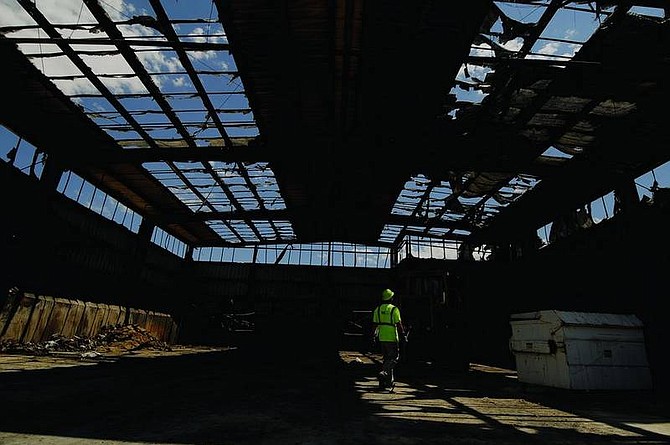 Kevin Clifford/Nevada AppealKland Moore, worker for Waste Management, walks through an empty Sutro Transfer Station Tuesday afternoon after a fire damaged the facility Monday afternoon.