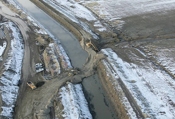 The levee that broke, flooding homes in Fernley and forcing evacuations Saturday, is in the process of being repaired Sunday. As many as 400 homes were damaged when the canal&#039;s bank gave way following heavy rainfall Friday.   Brad Horn/ Nevada Appeal