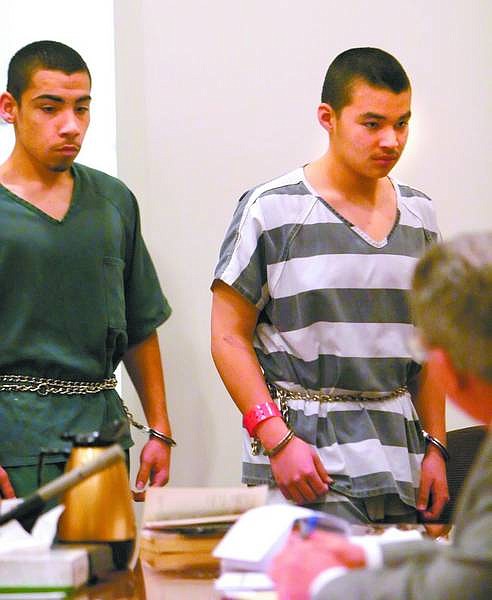 AMY LISENBE/Nevada Appeal File Photo Francisco Monroy, 15, left, and Adrian Garcia, 14, right, enter the courtroom Jan. 7 for a preliminary hearing. Both are charged with suspicion of attempted murder, battery with a deadly weapon and burglary with a deadly weapon following a stabbing Dec. 23.
