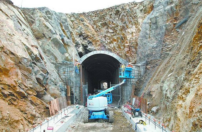Cathleen Allison/Nevada Appeal A Granite Construction crew works on the V &amp; T Railway tunnel No. 2, near Gold Hill on Tuesday afternoon. Officials are seeking more funding for the 18-mile tourist railroad.