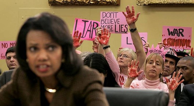 AP Photos/Susan WalshWith members of the protest group Code Pink behind her, including co-founder Medea Benjamin, second from right, Secretary of State Condoleezza Rice testifies on Capitol Hill in Washington on Wednesday, before the State, Foreign Operations and Related Programs subcommittee hearing on the State Department&#039;s fiscal 2009 budget.