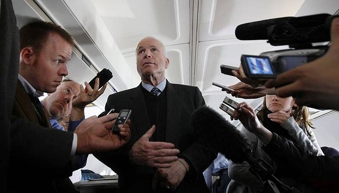 AP Photo/Gerald HerbertRepublican presidential hopeful, Sen. John McCain, R-Ariz., talks to reporters in flight from South Burlington Vt. to Warwick R.I., Thursday.