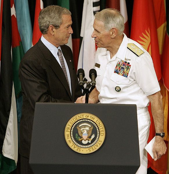 ** FILE ** President Bush shakes hands with head of the U.S. Central command, Navy Admiral William J. Fallon before a speech to coalition forces during a visit to the U.S. Central Command at MacDill Air Force Base in Tampa, Fla. in this May 1, 2007 file photo. Defense Secretary Robert Gates announced Tuesday, March 11, 2008, that Fallon is resigning.  (AP Photo/Chris O&#039;Meara, File)
