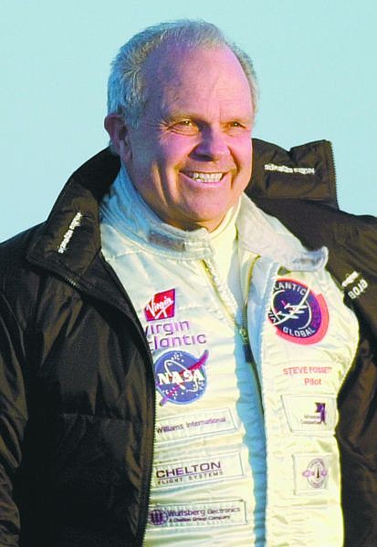 ** FILE ** Pilot Steve Fossett walks across a windy runway to the GlobalFlyer at the Salina Municipal Airport in Salina, Kan. in this  Feb. 28, 2005 file photo. Fossett, who risked his life seeking to set records in high-tech balloons, gliders and jets, was declared dead on  Friday, Feb. 15, 2008,  five  months after he vanished while flying in an ordinary small plane.    (AP Photo/Charlie Riedel)