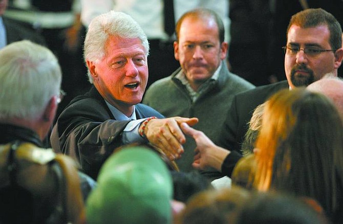 Cathleen Allison/Nevada Appeal Former President Bill Clinton greets supporters while campaigning for his wife, presidential candidate Hillary Clinton, at the Carson City Fire Department Tuesday.