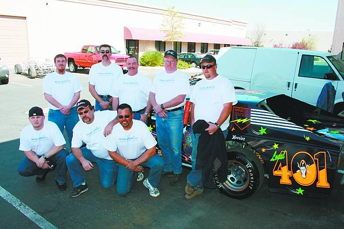 Rhonda Costa-Landers/NevadaAppeal Racing for Make-A-Wish in 2008 are, kneeling from left, Nick Ellsworth, Dan Prowinski and Paul Kitchener, back row, Michael Teegarden, Duane Kramer, Rod Gianchetta, Marty Dobson and Chris Michelson. Tickets for the racecar will be sold at each IMCA race, which will be given away at a drawing at the end of the season.