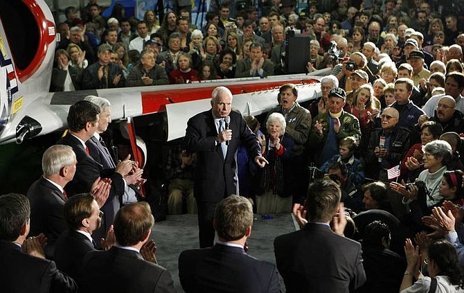 AP Photo/Gerald HerbertRepublican presidential hopeful, Sen. John McCain, R-Ariz., speaks at a rally at the Virginia Aviation Museum in Richmond, Va., Monday. Partially visible behind him is the wing of an A-4 Skyhawk fighter jet like the one he was flying when shot down over Vietnam.