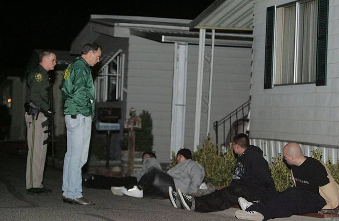 Photograph by Brad Horn/Nevada Appeal Carson City Sheriff Kenny Furlong questions suspects that were pulled over after entering the Comstock Mobile Home Park less than a minute after a car carrying four males that shot toward Carson City Sheriff&#039;s Dep. Gary Underhill tried to evade police in the 2600 block of College Parkway on Saturday evening.