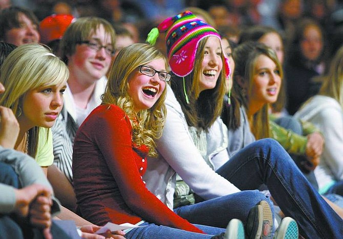 Photos by Cathleen Allison/Nevada Appeal Eight-graders Jaylin Massey, 13, left, and Lani Karosich, 14, watch the Freshman Orientation program Thursday night at Carson High School. An estimated 700 freshmen will enter CHS in the fall.
