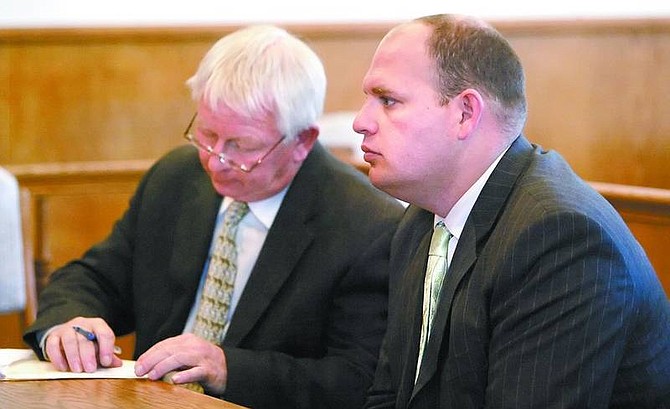 Amy Lisenbe/Nevada Appeal Jason McLean, right, listens to the terms of his wavier to a preliminary hearing Thursday afternoon in Dayton Valley Justice Court as his defense attorney, Ken Ward, takes notes.