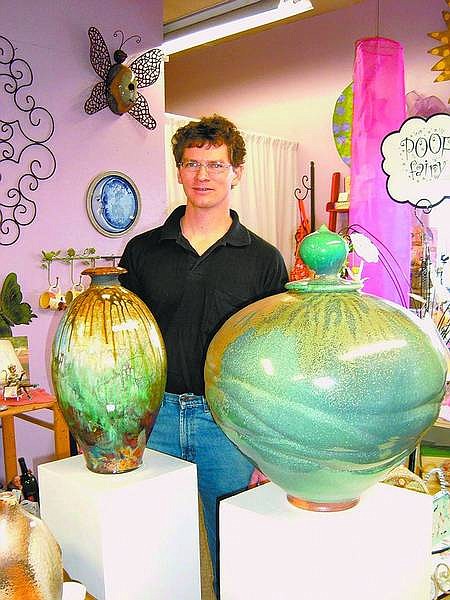 Mary Jean Kelso/Nevada Appeal News Service Joe Winter, a museum-quality potter from Red Rock, joined other local artists Feb. 7 at the Mirage Garden and Gifts to display his unusual pottery. Winter uses clay and glazes that are sometimes mixed with local crushed rock to produce unusual textures and colorings.
