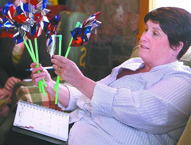 Cathleen Allison/Nevada Appeal Rhonda Roth, parenting coordinator for the Advocates to End Domestic Violence, talks recently about upcoming events, such as the pinwheel placement Tuesday on the Legislative lawn to remember abused children.