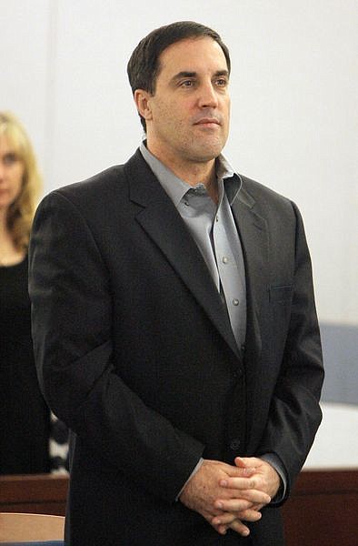 Darren Mack appears in a Clark County courtroom during jury selection in the murder and attempted murder trial in Las Vegas, Monday, Oct. 15, 2007. Mack, a 46-year-old businessman, is charged with fatally stabbing his estranged 39-year-old wife, Charla, on June 12, 2006, and shooting, sniper-style, their divorce judge, Chuck Weller. (AP Photo/Jae C. Hong)