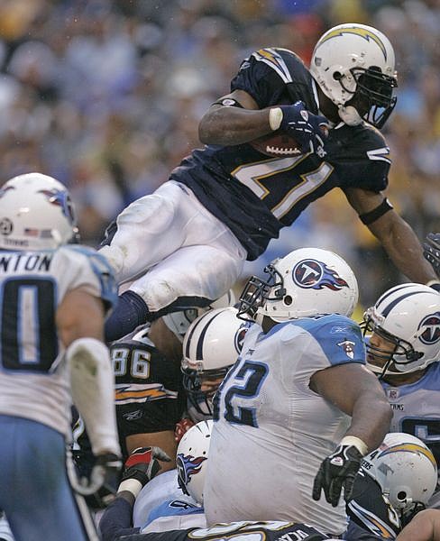 San Diego Chargers LaDainian Tomlinson goes over the top for a one-yard touchdown in the fourth quarter of the Chargers&#039; 17-6 victory over the Tennessee Titans in their wild-card playoff football game Sunday, Jan. 6, 2008, in San Diego. (AP Photo/Lenny Ignelzi)