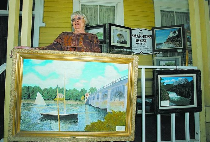 BRAD HORN/Nevada Appeal Marilyn Koschella displays her painting of Claude Monet&#039;s &quot;The Bridge at Argenteuil&quot; at the Foreman Roberts House Museum on Saturday.