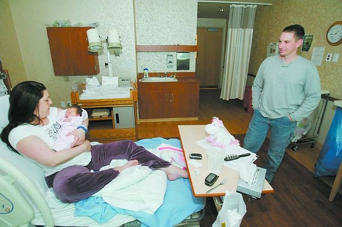 BRAD HORN/Nevada Appeal Bethany Love gave birth to Malia Jade Love at Carson Tahoe Regional Medical Center at 9:13 a.m. Valentine&#039;s Day. Father Leland Love watches mother and daughter on Friday morning. Malia is Leland and Bethany Love&#039;s first child.