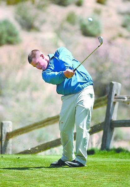 Cathleen Allison/Nevada Appeal Zack Rispin tees off for Carson High School on Tuesday at Silver Oak Golf Course.