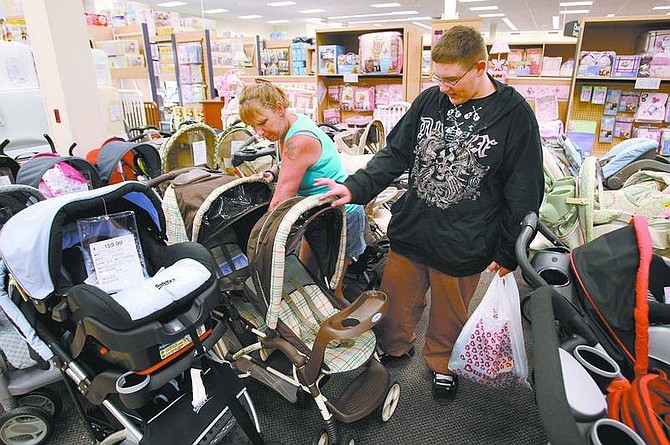Cathleen Allison/Nevada AppealSandi Krzyzan and her son Keith, 13, look at strollers in the new Burlington Coat Factory on Friday afternoon. The 70,000-square-foot store opened in the former Wal-Mart building in South Carson City.