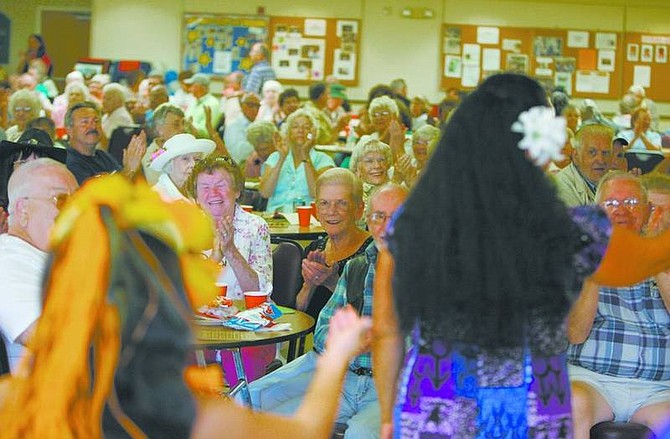 BRAD HORN/Nevada AppealThe audience erupts with applause after the Halau Hula O&#039;Leilani group from Reno finished its performance during the grandparent&#039;s day barbecue at the Carson City Senior Citizens Center on Sunday.