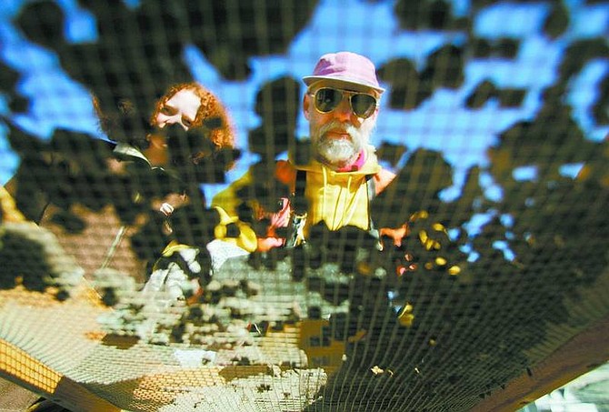 BRAD HORN/Nevada Appeal File PhotoProfessor Ron Reno, center, and Corinna Obermayr, 12, sift dirt through a screen at the Silver City Schoolhouse archeological dig earlier this year. Reno will lecture on the subject Tuesday at the Gold Hill Hotel.