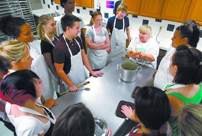 Cathleen Allison/Nevada AppealCarson High School culinary arts teacher Penny Reynolds talks Thursday morning to her students. Some of the culinary students will participate in this weekend&#039;s Taste of Home Cooking School show.