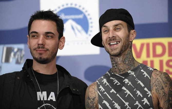 AP Photo/Chris PizzelloIn this Sept. 7, 2008 file photo, DJ AM, left, and musician Travis Barker pose backstage at the 2008 MTV Video Music Awards held at Paramount Pictures Studio Lot in Los Angeles. A hospital spokeswoman in Columbia, S.C. says former Blink-182 drummer Barker and DJ AM, whose real name is Adam Goldstein, have been critically injured in a Learjet crash that occurred shortly before midnight on Friday, Sept. 19, 2008 in South Carolina. Federal officials say two crew members and two passengers have been killed.