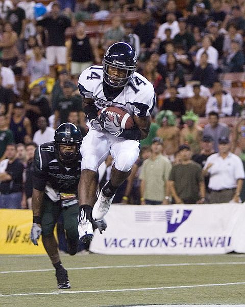 Nevada wide receiver Chris Wellington catches a touchdown pass over Hawaii defensive back Erik Robinson to tie the game 31-31during the fourth quarter of the NCAA college football game at Aloha Stadium on Saturday, Oct. 25, 2008 in Honolulu.  Hawaii won the game 38-31.  (AP Photo/Marco Garcia)