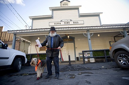 Greg Pace walks his dog Dolly out of the Genoa Town Hall after voting Tuesday, Nov 4, 2008, in Genoa, Nev. (AP Photo/Scott Sady)